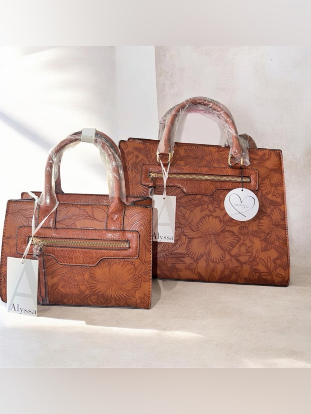 Floral-Embossed Brown faux Leather Tote with mini tote included.